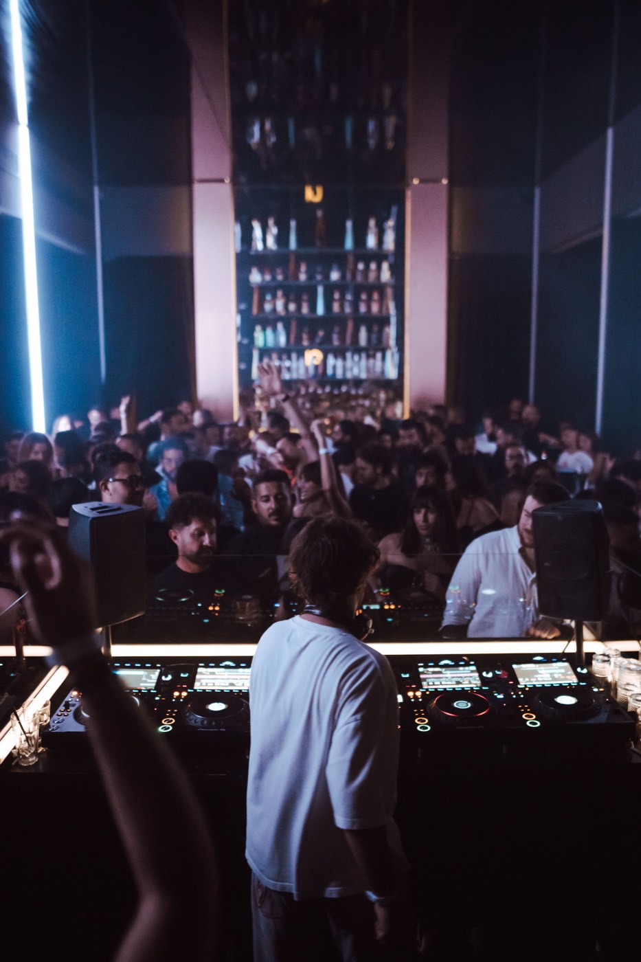 A packed club from behind the booth